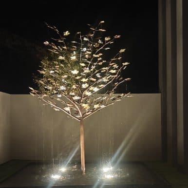 Copper Raining Tree Fountain at Night